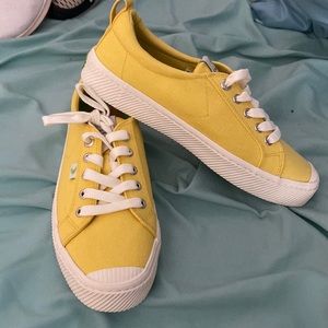 Cariuma yellow tennis shoes